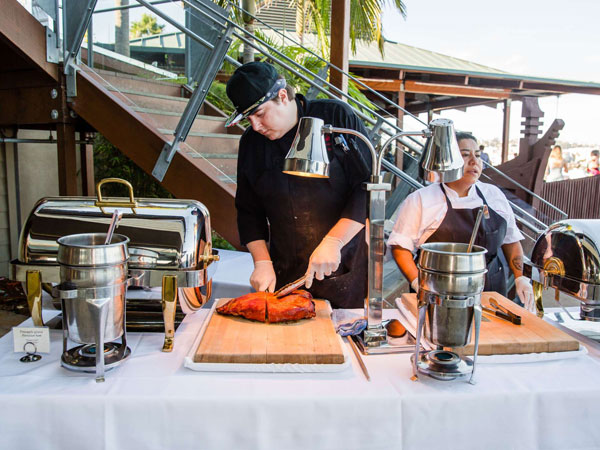 A chef slicing up meat