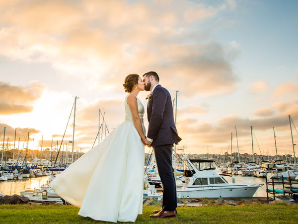 A happy couple in front of the San Diego harbor