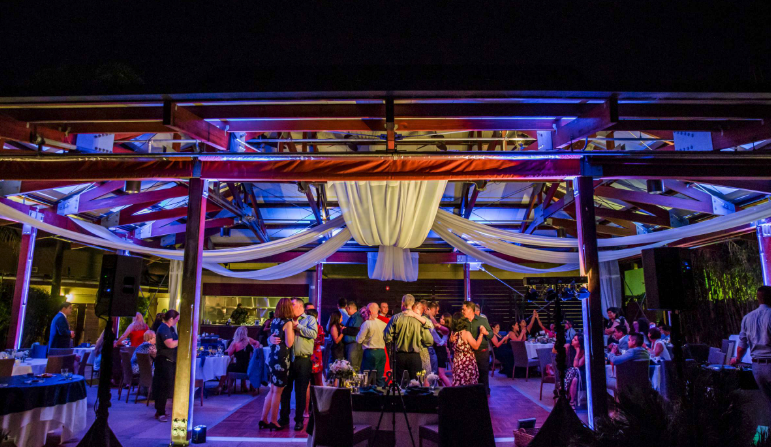 Outdoor wedding celebration with dancing